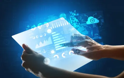Hands holding a futuristic tablet displaying glowing data, charts, and a globe.