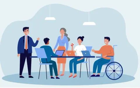 Team di lavoro eterogeneo, con persone di diverse età e un uomo in carrozzina, che collaborano in un ufficio moderno. Esempio di diversity management.