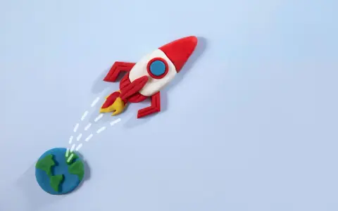 Un razzo di plastilina decolla dalla Terra, pronto per nuove avventure. La risposta a "perché vuoi lavorare con noi" è: per spiccare il volo verso il successo!